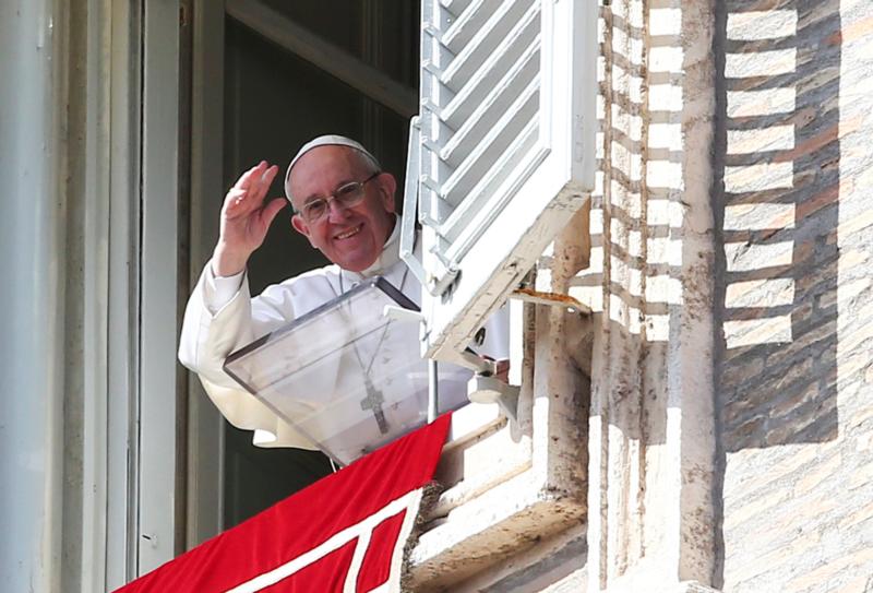 Pope Francis waves as he leads the Angelus from his studio overlooking St. Peter's Square Feb. 26 at the Vatican. (CNS photo/Alessandro Bianchi, Reuters) See POPE-ANGELUS-WORRIES Feb. 27, 2017.